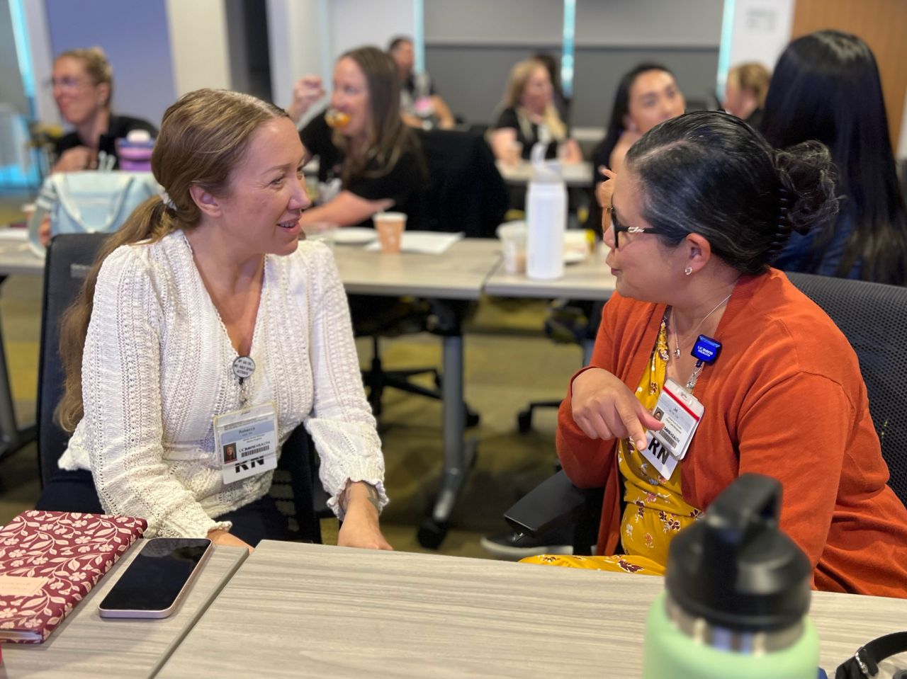 Two women talking during NPD Week Event at UC Davis Health